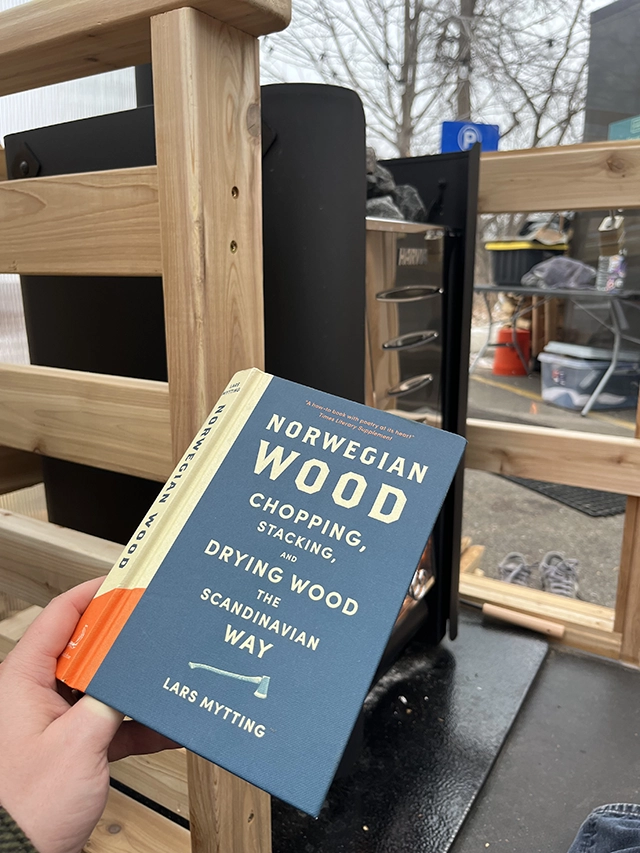 Reading the book Norwegian Wood inside a sauna.